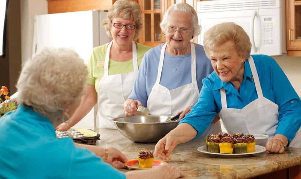 Group of Seniors Having Fun While Baking